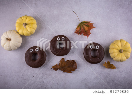 Halloween festive donuts with eyes. Halloween festive donuts with eyes. 95279386