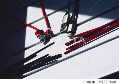 Abstract connection of incense sticks and usb cord with connectors Abstract connection of incense sticks and usb cord with connectors 95279806