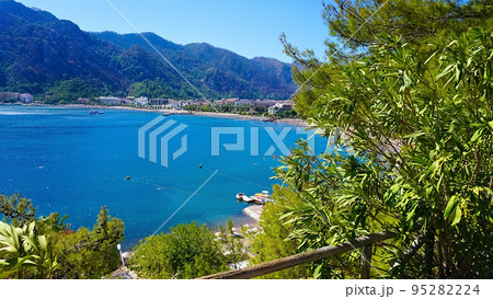 Icmeler Beach view in Marmaris Town. Summer landscape on the Mediterranean coast in Turkey. Icmeler Beach view in Marmaris Town. Summer landscape on the Mediterranean coast in Turkey. 95282224