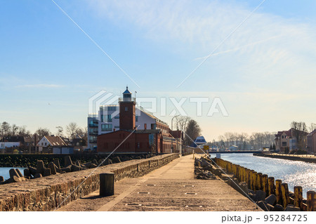 Old brick lighthouse at the Wieprza river mouth to the Baltic Sea in Darlowko, Poland Old brick lighthouse at the Wieprza river mouth to the Baltic Sea in Darlowko, Poland 95284725