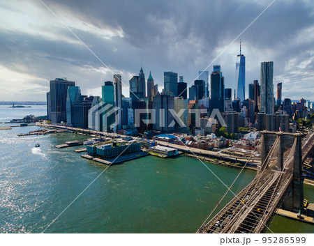 Panoramic aerial view cityscape Manhattan along East river over beautiful Brooklyn Bridge New York City, U.S. Panoramic aerial view cityscape Manhattan along East river over beautiful Brooklyn Bridge New York City, U.S. 95286599