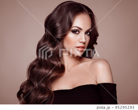 Brunette woman with curly hair Brunette woman with curly hair 95295293