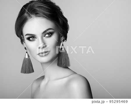 Beautiful Woman with Large Earrings Tassels Beautiful Woman with Large Earrings Tassels 95295469