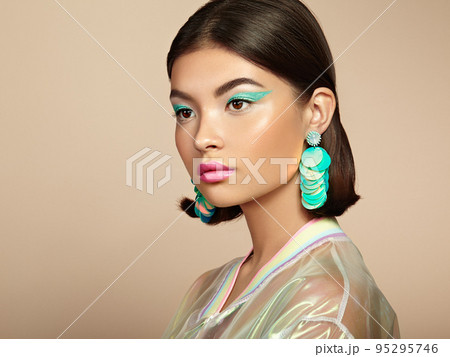 Beautiful Korean Woman with large turquoise earrings Beautiful Korean Woman with large turquoise earrings 95295746