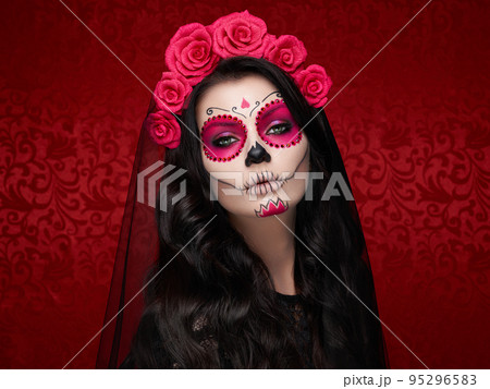 Portrait of a woman with makeup sugar skull Portrait of a woman with makeup sugar skull 95296583