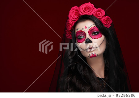 Portrait of a woman with makeup sugar skull 95296586