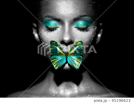 Beauty model woman with green butterfly 95296623