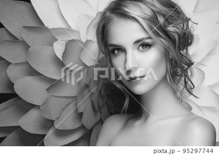 Beautiful woman on the background of a large flower 95297744