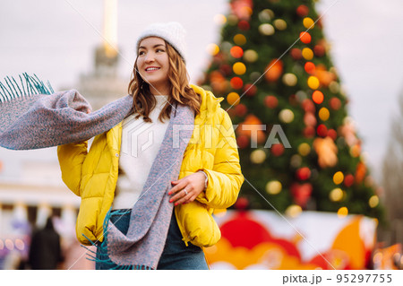 Beautiful woman have fun, active ice skating on the ice arena in the city in winter on Christmas Eve. Beautiful woman have fun, active ice skating on the ice arena in the city in winter on Christmas Eve. 95297755
