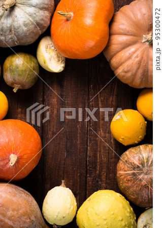 frame for inscription of farm organic pumpkins on wooden background 95300472