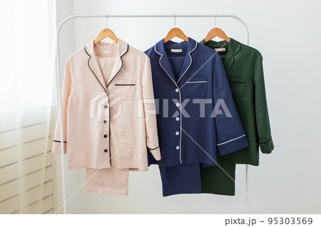 Clothing retails concept. Ladies pajamas on hangers in clothes store. Pajama in shop. Advertise, sale, fashion and shopping concept. Clothing retails concept. Ladies pajamas on hangers in clothes store. Pajama in shop. Advertise, sale, fashion and shopping concept. 95303569