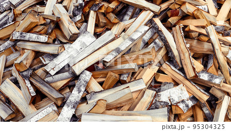 Pile of chopped firewood of Birch background Pile of chopped firewood of Birch background 95304325