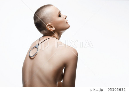 beautiful woman with short haircut. Back of naked bald Girl with Necklace 95305632