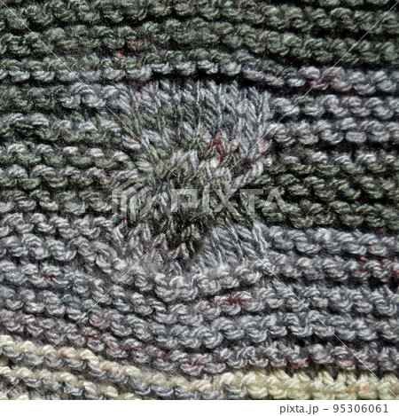 Handmade knitted fabric grey wool background texture Handmade knitted fabric grey wool background texture 95306061