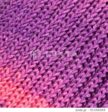 Handmade knitted fabric purple and pink wool background texture Handmade knitted fabric purple and pink wool background texture 95306069