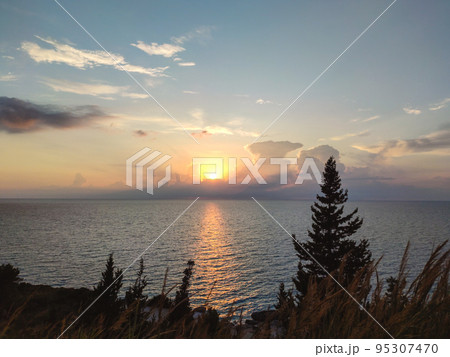 Epic sunset above sea on Lefkada island, Greece 95307470