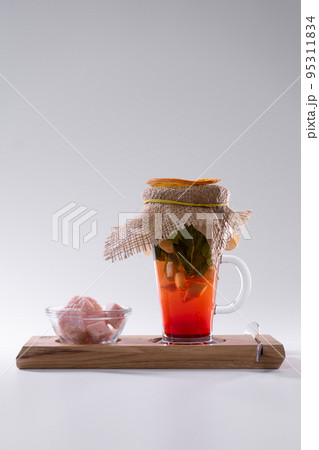 fresh vitamin red ginger tea cup with strawberry, mint, pink sugar isolated fresh vitamin red ginger tea cup with strawberry, mint, pink sugar isolated 95311834