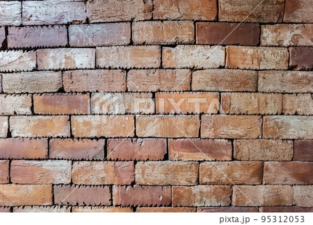 Brown brick wall. Texture of brown brick wall pattern background. Abstract wallpaper texture with old and vintage style pattern. Home or office design backdrop. Outstandingly beautiful architecture. Brown brick wall. Texture of brown brick wall pattern background. Abstract wallpaper texture with old and vintage style pattern. Home or office design backdrop. Outstandingly beautiful architecture. 95312053