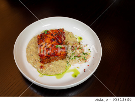 Healthy piece of cooked meat with porridge and salad Healthy piece of cooked meat with porridge and salad 95313336