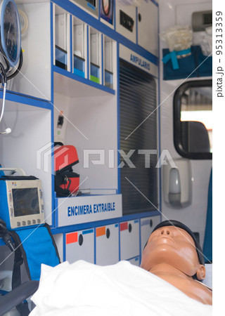 ambulance perfectly equipped with emergency equipment and dummy for first aid practices 95313359
