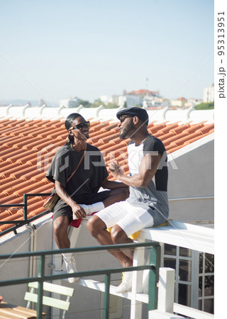 Portrait of smiling African American gay lovers talking Portrait of smiling African American gay lovers talking 95313951