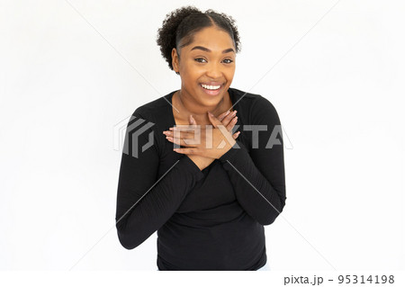 Portrait of happy young woman feeling grateful Portrait of happy young woman feeling grateful 95314198