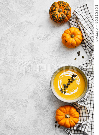 Homemade autumn pumpkin soup with squash seeds Homemade autumn pumpkin soup with squash seeds 95315251