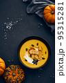 Pumpkin cream soup with croutons on dark background 95315281