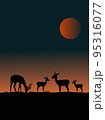 Four deer silhouettes on a hill with sunset in the background. 95316077