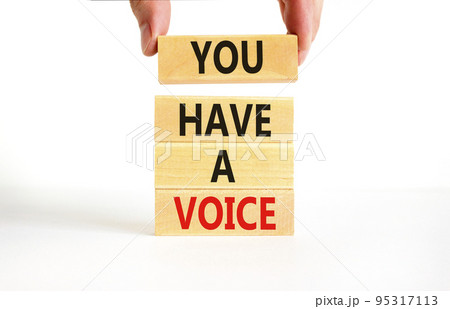 You have a voice symbol. Concept words You have a voice on wooden blocks. Beautiful white table white background. Businessman hand. Business, psychological you have a voice concept. Copy space. 95317113