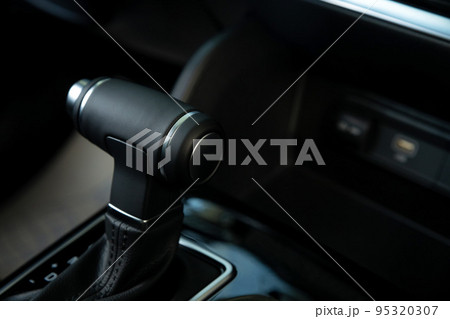 Close-up of automatic gearbox handle in the modern car Close-up of automatic gearbox handle in the modern car 95320307