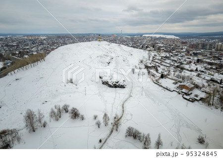 Flight over Lisya mountain or Fox mountain in the city of Nizhny Tagil, Russia. Aerial view Flight over Lisya mountain or Fox mountain in the city of Nizhny Tagil, Russia. Aerial view 95324845
