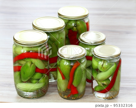Homemade pickled achocha, Cyclanthera pedata, with chilli peppers Homemade pickled achocha, Cyclanthera pedata, with chilli peppers 95332316