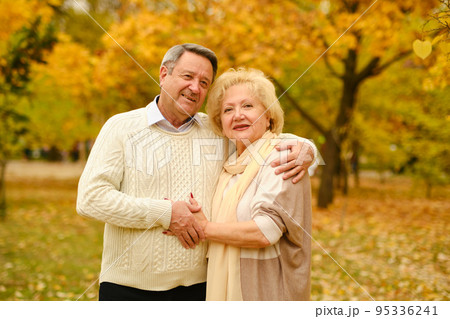 Active seniors on a walk in forest Active seniors on a walk in forest 95336241