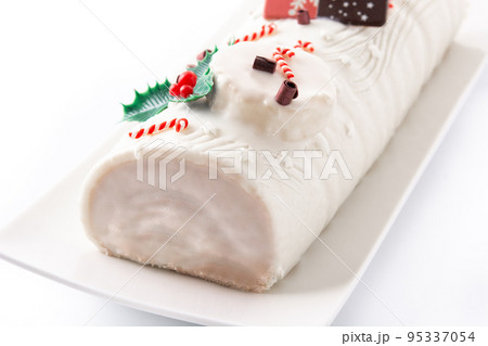 White chocolate yule log cake with christmas ornament isolated on white background 95337054