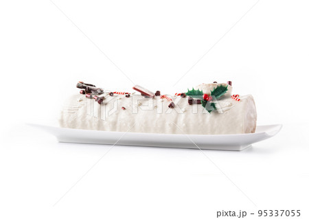 White chocolate yule log cake with christmas ornament isolated on white background 95337055