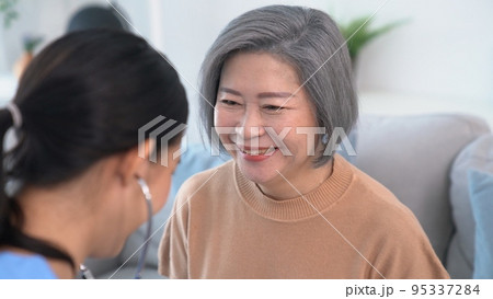 A contented retired senior woman being exterminated by her caregiver A contented retired senior woman being exterminated by her caregiver 95337284