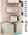 Organizing home storage. Organization of home space. Storage of things in the dressing room on the shelves in textile baskets and boxes 95339159