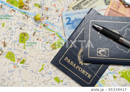 ARgentine passports and different money on a map planning a vacation. Vacation concept, travel. Copy space 95339417