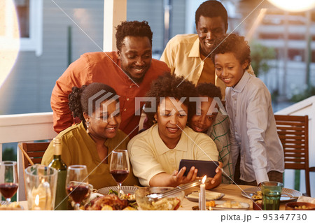 Family using Video Call at Dinner 95347730