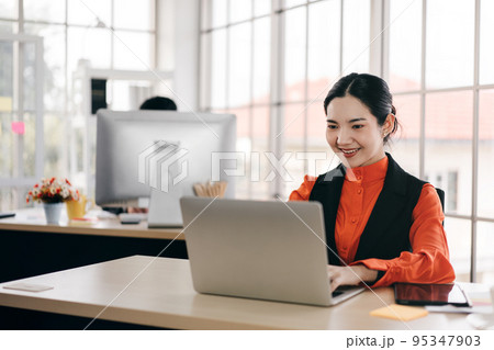 Business woman working in office and social distance work table. 95347903