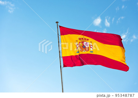 National Flag of Spain on blue sky background National Flag of Spain on blue sky background 95348787