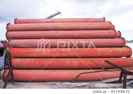 Rusted iron steel metal pipes stack an industrial field Rusted iron steel metal pipes stack an industrial field 95348870
