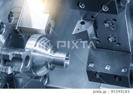 The CNC lathe machine thread cutting at the end of metal stud parts. 95349183