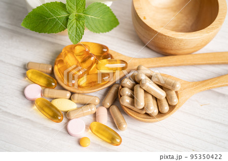 Alternative medicine herbal organic capsule with vitamin E omega 3 fish oil, mineral, drug with herbs leaf natural supplements for healthy good life. Alternative medicine herbal organic capsule with vitamin E omega 3 fish oil, mineral, drug with herbs leaf natural supplements for healthy good life. 95350422