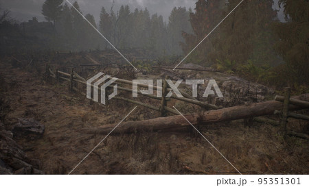 An old wood fence with a country field behind it An old wood fence with a country field behind it 95351301