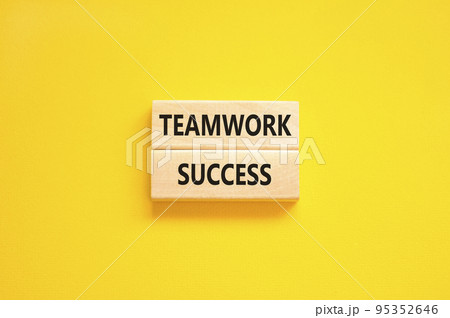 Teamwork success symbol. Concept words Teamwork success on wooden blocks on a beautiful yellow table yellow background. Business and teamwork success concept. Copy space. 95352646