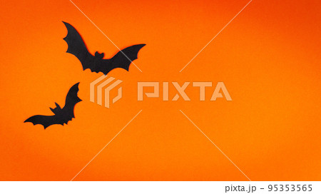 Orange cute Halloween background design with bats silhouettes copy space 95353565