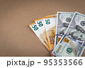Paper money banknotes dollars and euros on a brown background with a vintage paper texture. Close up. Copy Space. Grunge 95353566