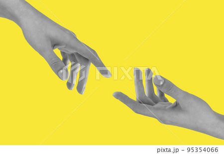 Hands reaching each other on yellow background 95354066